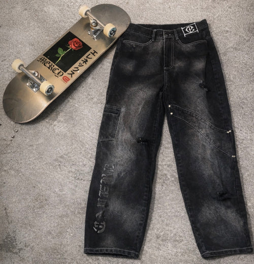 a pair of jeans and a skateboard